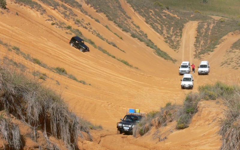 Vehicles driving up and down the 'sand-pit'