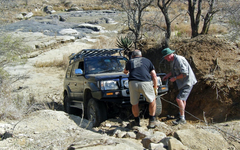 Fixing up the winch to pull our Prado up a steep, rocky incline