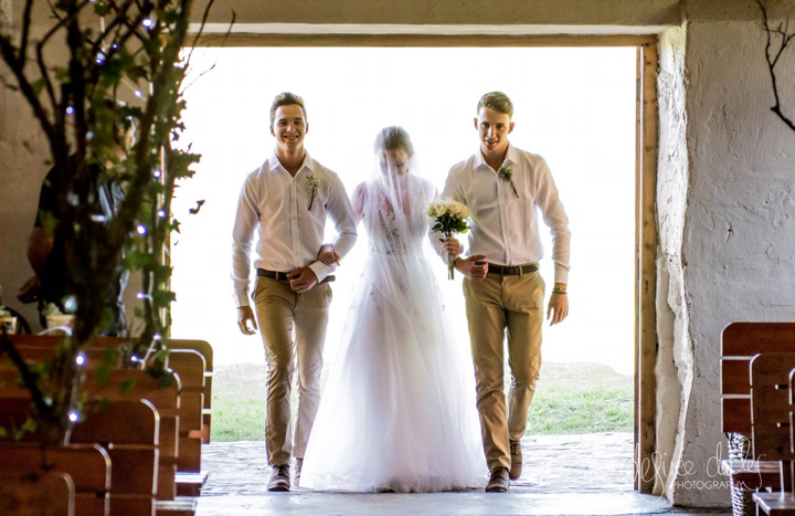 Veronica with Jason and Mark on either side as she walked into the chapel.