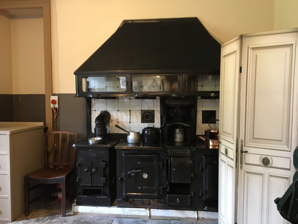 An old stove with pans etc.