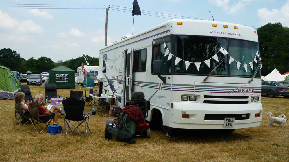 Bertha (Paul's winnebago) parked up and decked with flags.