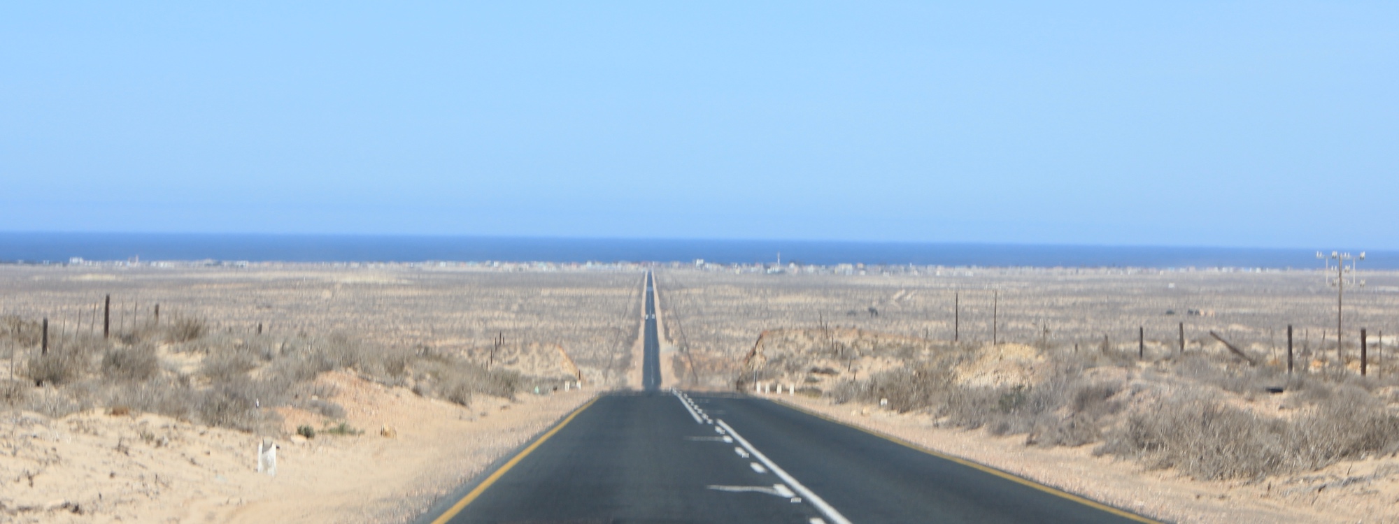 The road to Port Nolloth with the Atlantic Ocean in the background