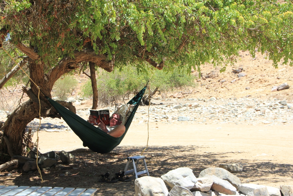 Kevin enjoying his hammock under a shady tree.