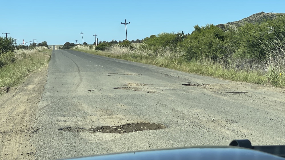 Potholes on the road.